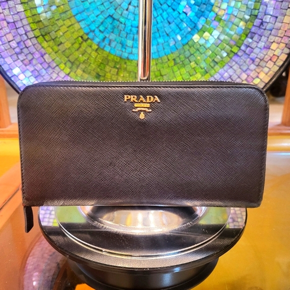 Prada Handbags - Prada Saffiano Black Leather all-around zipper large Wallet.